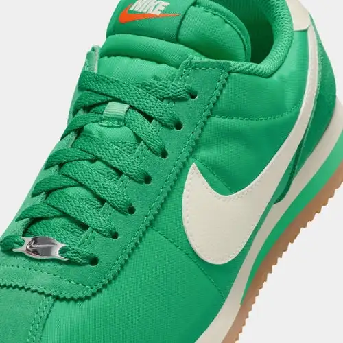 Cortez Textile Womens Lifestyle Shoes (Stadium Green Safety Orange Gum Light Brown Coconut Milk)
